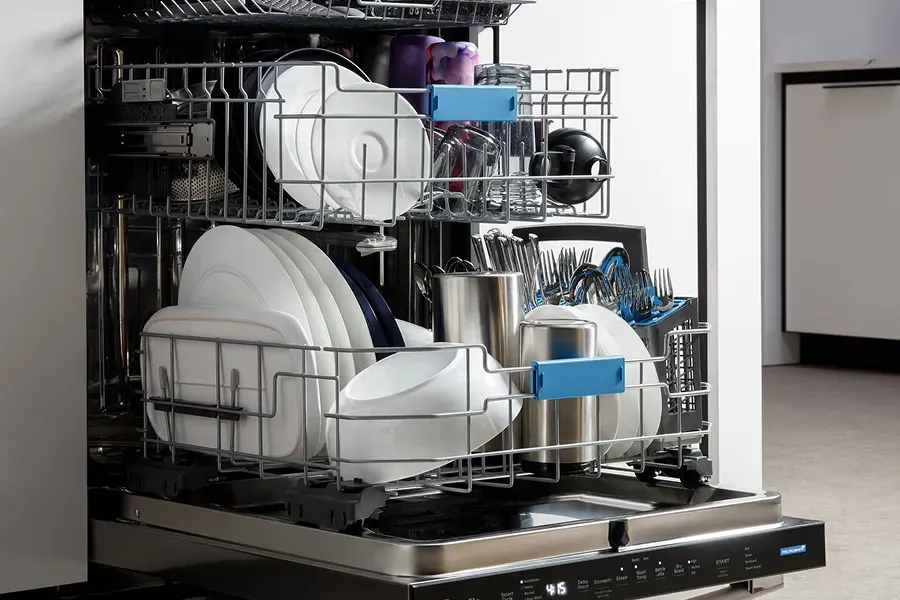 Open GE Profile dishwasher PDT715SYVFS loaded with dishes showing top control panel and stainless interior.